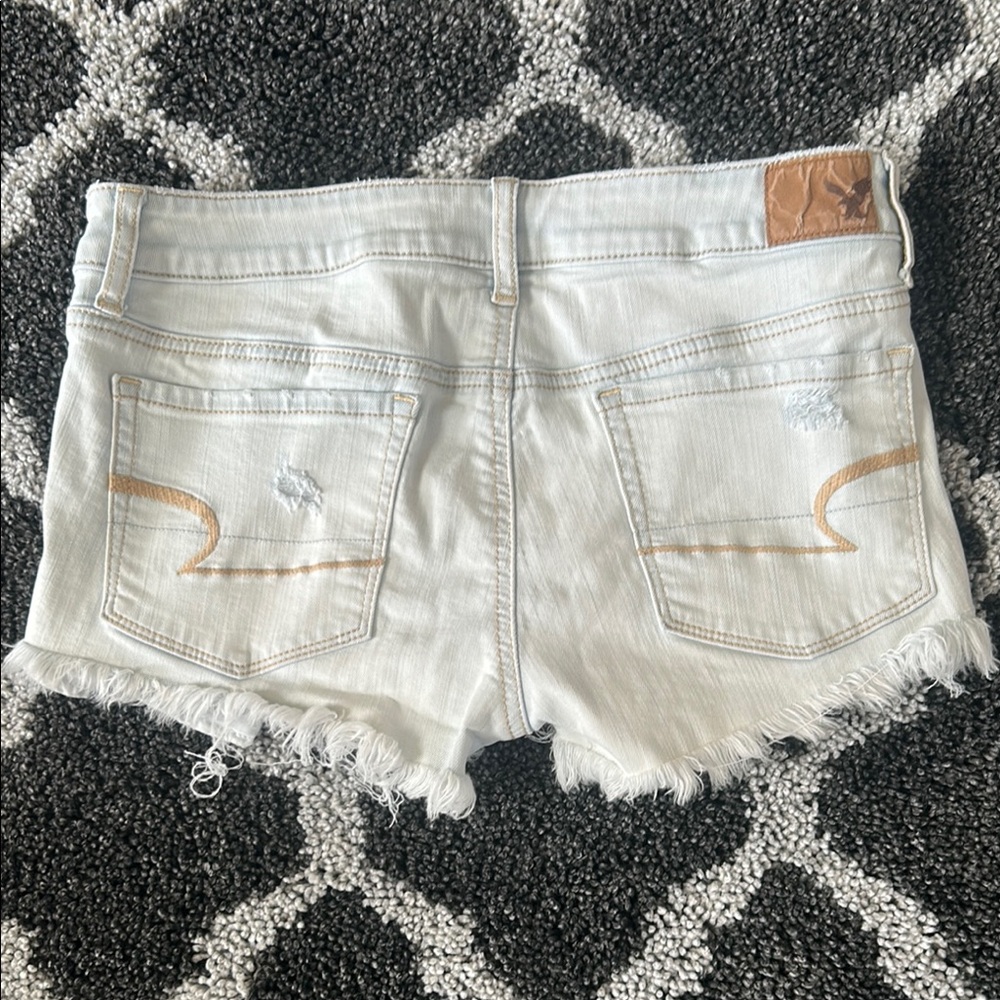 American Eagle Super Low Shortie Distressed Light Blue Denim Shorts Size 8 - Picture 2 of 4